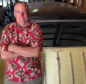 David Kugle next to a classic vintage car